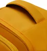 A close-up view of a yellow backpack's handle and fabric. Produktbild-Vorschau