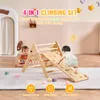 Two babies are playing with a wooden climbing set indoors. Podgląd zdjęcia produktu