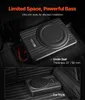 A car subwoofer is shown installed under a car seat and in a car trunk. Produktbild-Vorschau
