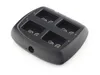 A black battery charger with four slots for batteries. Podgląd zdjęcia produktu