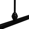 A close-up view of a black metal bed frame, focusing on a decorative spherical element attached to a vertical support post and resting on a horizontal bar. Produktbild-Vorschau