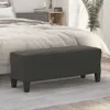 A dark gray bench is placed in front of a bed in a bedroom setting. Náhľad obrázku produktu