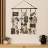 A wall hanging photo frame with multiple animal and plant images displayed on a wall above a wooden dresser. Náhled obrázku produktu