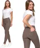 Two images of a woman wearing beige leggings and a white t-shirt, shown from the front and side. Produktbild-Vorschau