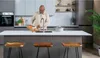 A man is preparing food in a modern kitchen. Produktbild-Vorschau