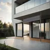 A modern house with a patio and a retractable awning. Produktbild-Vorschau