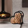 A modern living room with a fireplace and a heart-shaped firewood rack. Podgląd zdjęcia produktu