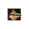 A top-down view of a ceramic clown figurine on a black background. Produktbild-Vorschau