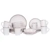 A set of white ceramic dishes with a speckled pattern and brown rim, arranged on a white background. Náhled obrázku produktu