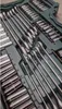 A close-up view of a tool kit, showing various wrenches and sockets neatly organized within a green case. Produktbild-Vorschau
