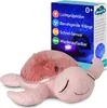 A pink plush turtle night light is shown next to its packaging, which displays features and the brand logo. Podgląd zdjęcia produktu