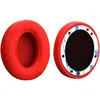 Two red ear pads for headphones are shown against a white background. Produktbild-Vorschau