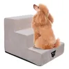 A poodle sits on a beige pet stair. Produktbild-Vorschau