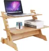 A wooden laptop stand with a laptop, books, and a small container on it, set against a white background. Produktbild-Vorschau