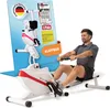 A man is using a white and red rowing machine. A large marketing graphic with awards and text is behind the machine. Produktbild-Vorschau