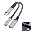 A close-up shot of a USB-C adapter with two outputs, one for audio and one for charging. Produktbild-Vorschau