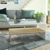A modern living room scene with a couch and coffee table. Podgląd zdjęcia produktu