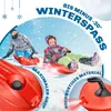 Two people are sledding down a snowy hill on red sleds. Produktbild-Vorschau
