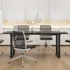 A modern office meeting room with a black height-adjustable desk and chairs. Anteprima dell’immagine prodotto