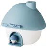 A blue and white mushroom-shaped humidifier with a small mushroom character in the doorway. Produktbild-Vorschau