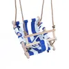 A baby swing with blue and white stripes, made of fabric and wood, suspended by ropes. Produktbild-Vorschau