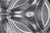 Close-up view of the inside of a washing machine drum. Voir les images du produit