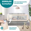 A baby sleeping in a bed with a bed rail, and a hand holding a baby bottle. Produktbild-Vorschau