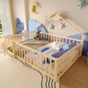 A child's bedroom with a wooden bed frame, stuffed animals, and decorative stars on the wall. Voir les images du produit