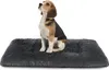 A beagle dog sits on a dark gray plush dog bed against a white background. Produktbild-Vorschau