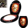 A toilet seat and lid with a skull and flame design. Produktbild-Vorschau