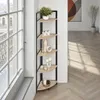 A corner shelf unit with decorative items placed on it, next to a large window with a view of a balcony and buildings. Náhled obrázku produktu