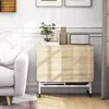 A foldable dining table is shown in a living room setting next to a sofa, with decorative items on top. Produktbild-Vorschau