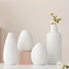 Set van 4 witte decoratieve keramische vazen Productafbeelding-voorbeeld 1