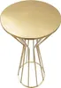 A gold round-top table with a decorative metal base, isolated on a white background. Produktbild-Vorschau