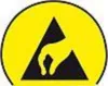 A yellow circle with a black triangle inside, which contains a yellow hand symbol. Náhľad obrázku produktu