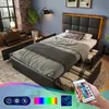 A bedroom scene featuring a bed with storage drawers and LED lighting, along with a remote control for the lights. Náhled obrázku produktu