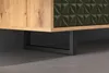 A close-up view of the bottom section of a piece of furniture, showing its wooden side panel, a textured dark green drawer front, and black metal legs. Podgląd zdjęcia produktu