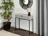 A console table with a drawer, a lamp, a plant, and a mirror in a room. Náhled obrázku produktu