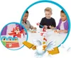 Three children playing a board game called Looping Louie. Produktbild-Vorschau