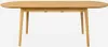 A light wood oval dining table with four legs, shown from the front. Produktbild-Vorschau