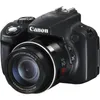 A black Canon PowerShot SX50 HS digital camera is shown from a front-diagonal angle against a white background. Produktbild-Vorschau