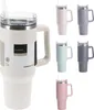 A collage of different colored travel mugs with straws and handles. Produktbild-Vorschau