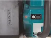 A close-up view of a power tool, showing the brand logo and battery indicator. Voir les images du produit