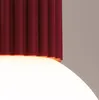A close-up view of a pendant light fixture, showing the top burgundy-colored ribbed shade and the bottom frosted glass diffuser. Produktbild-Vorschau