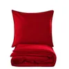A red duvet cover and pillowcase set folded and stacked on a white background. Produktbild-Vorschau
