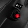 A close-up view of a red button and a symbol on a black textured surface, likely part of a tool or machine. Produktbild-Vorschau