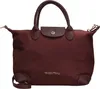 A studio shot of a burgundy handbag. Produktbild-Vorschau
