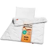 A white pillow and duvet set laid out on a white background, with a marketing tag placed on top. Voir les images du produit