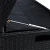 Close-up of the interior of a black rattan storage box, showing a gas strut mechanism. Produktbild-Vorschau