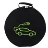 A black circular bag with a green outline of an electric car and charging cable. Podgląd zdjęcia produktu